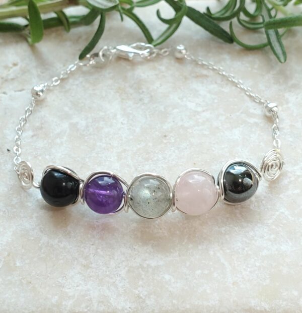 Empath bracelet in silver tone with amethyst, rose quartz, labradorite, hematite, and black tourmaline.