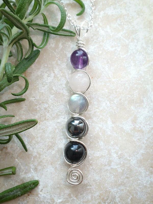 silver empath necklace with amethyst, rose quartz, labradorite, hematite, and black tourmaline.