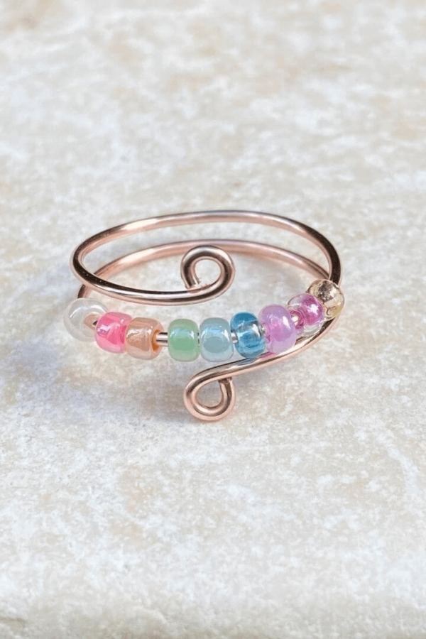 Rose Gold anxiety fidget rings with pastel rainbow bead