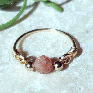 Handmade sunstone ring with a warm, shimmering glow.