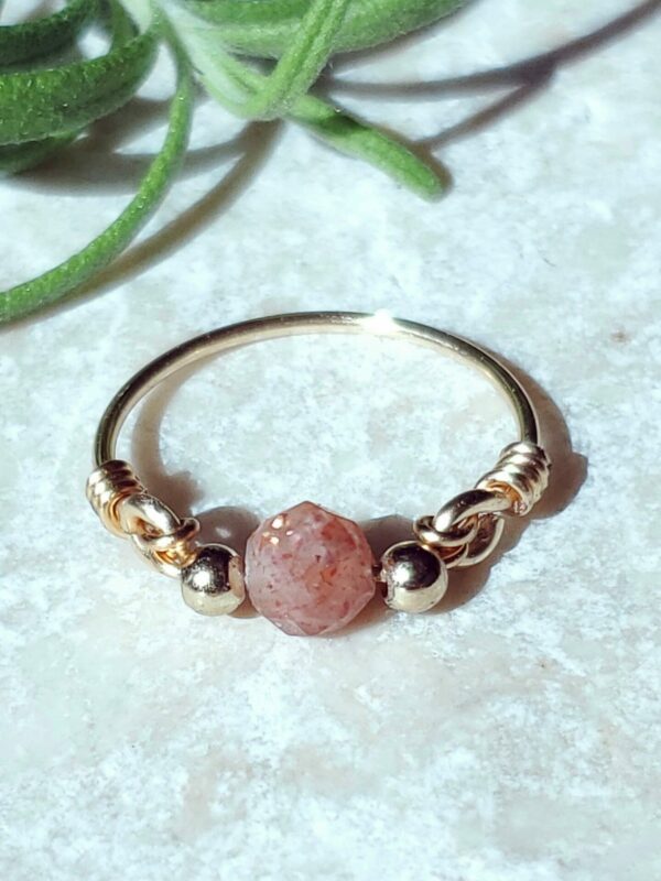 Handmade sunstone ring with a warm, shimmering glow.