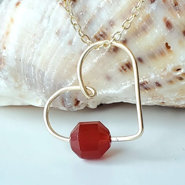 Handmade Crystal Heart Necklace featuring a Carnelian gemstone for creativity and motivation.