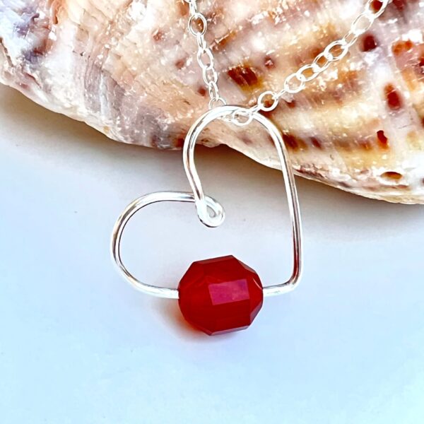 Handmade Crystal Heart Necklace featuring a Carnelian gemstone for creativity and motivation.