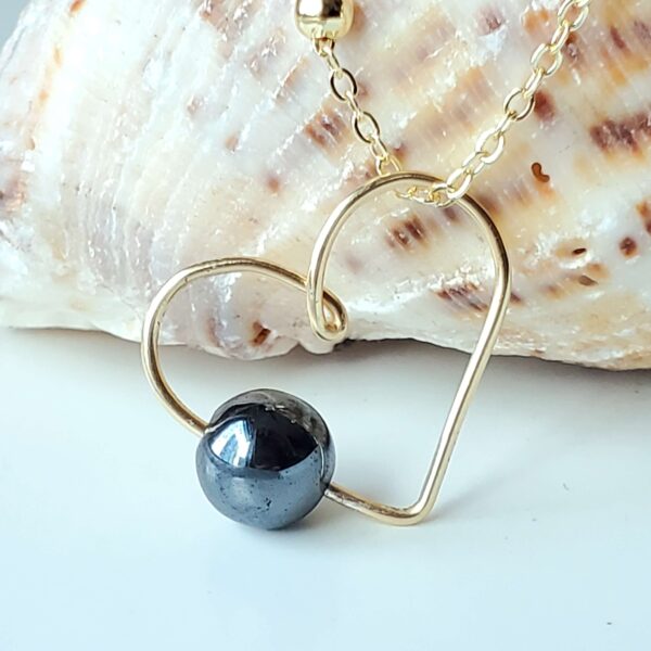 Handmade Crystal Heart Necklace featuring a Hematite gemstone for balance and focus.