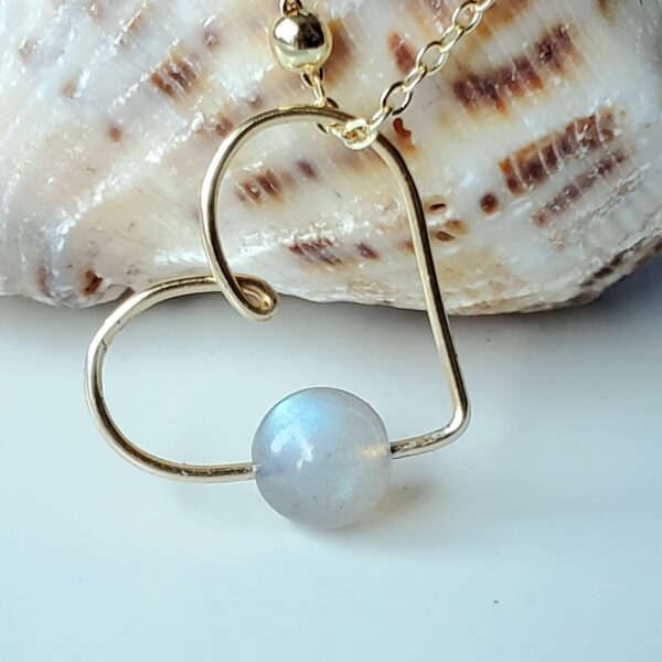 Handmade Crystal Heart Necklace featuring a Labradorite gemstone for protection and intuition.